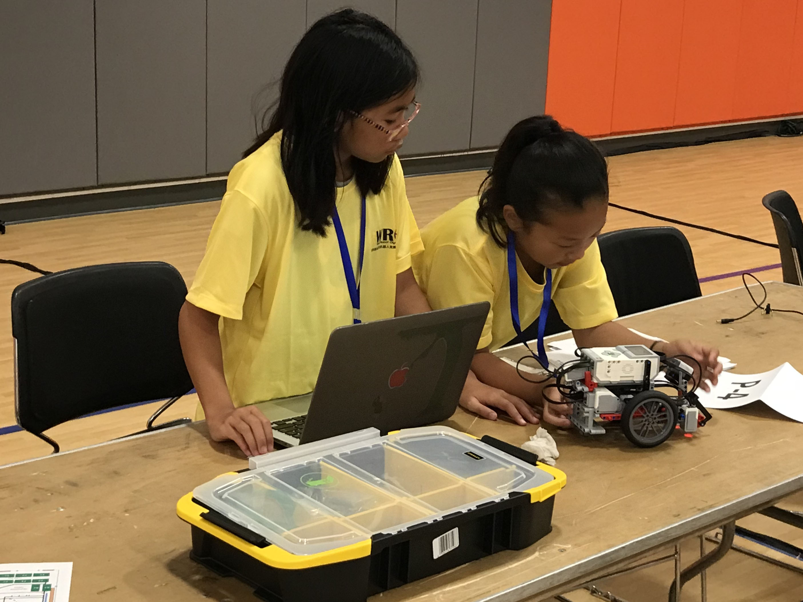 Teams assembling their robot for competition